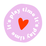 Circular sticker with red heart and 'it's play time' text on a light purple background